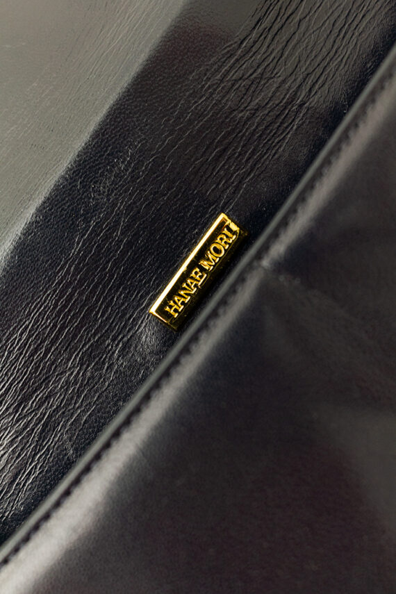 Vintage handtas van zwart leer met goudkleurige bolletjes Hanae Mori