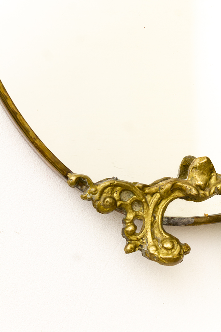 Vintage messing spiegel met decoratief hoofdje