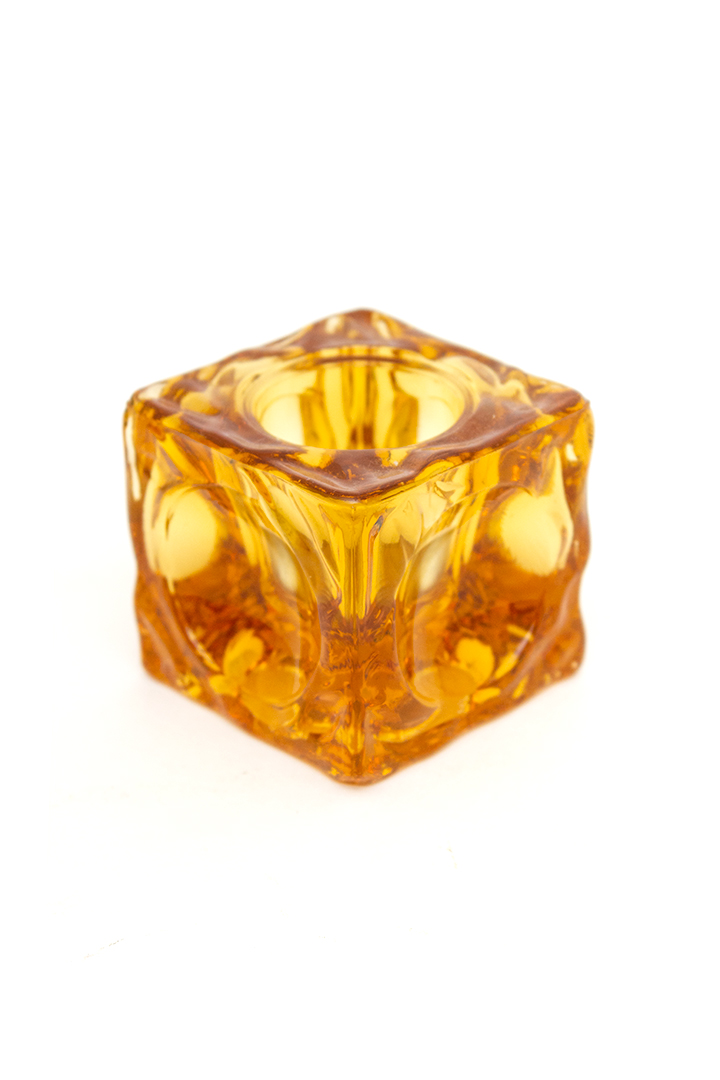 Vintage waxinelichthouder van amberkleurig glas