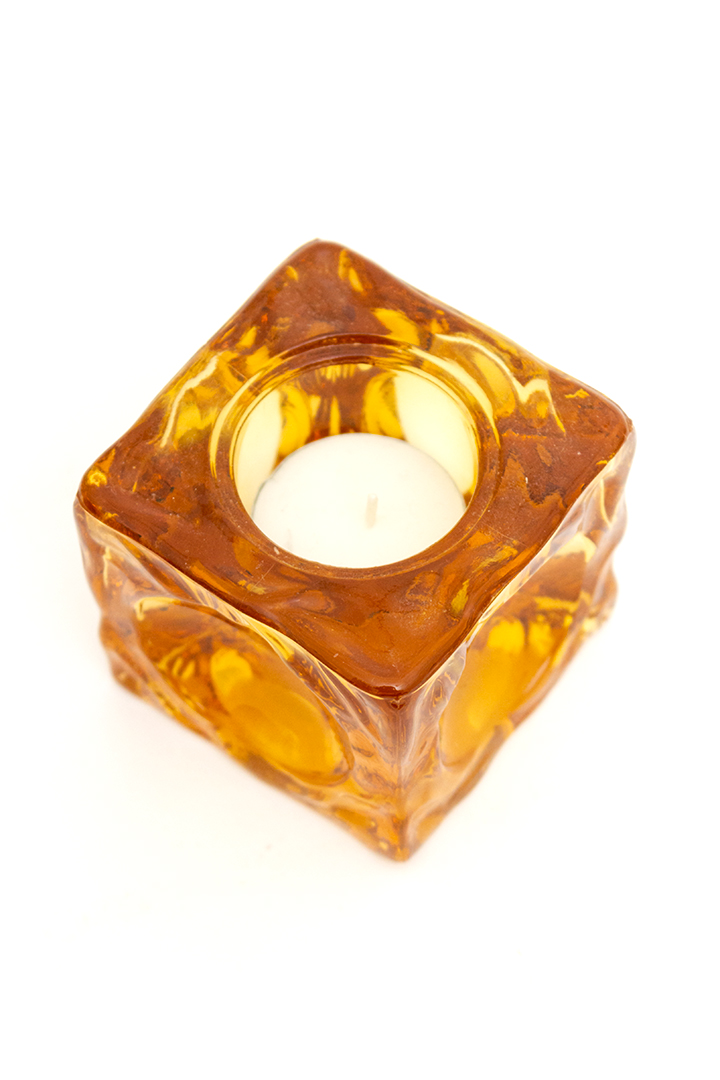 Vintage waxinelichthouder van amberkleurig glas